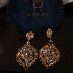 Miguel Ases statement earrings gold and silver